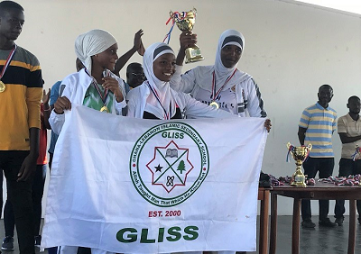 The GLISS volleyball team lift their cup in celebration  The GLISS volleyball team lift their cup in celebration