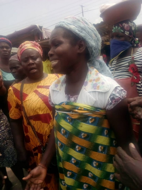 A trader weeping after losing her wares in the exercise