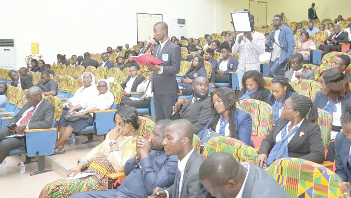  A student asking a question at the forum