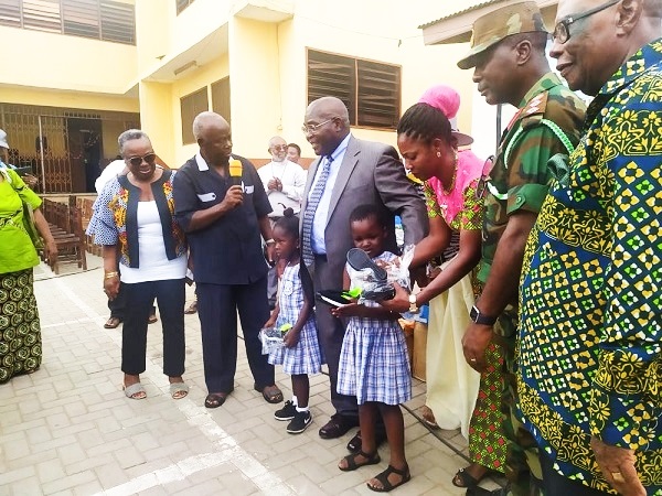Retired teacher donates to Bishop John Daly School