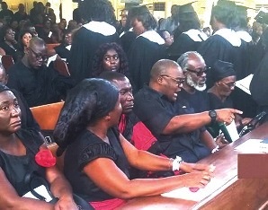 The remains of Colin Benjamin Essamuah being carried away to the cemetery after the burial service