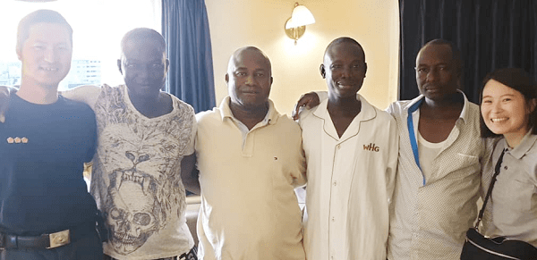 Staff of the hotel with Nana Opare Kwafo I (3rd left), Mr Alex A. Okyere (2nd left) and other Ghanaians after the rescue exercise