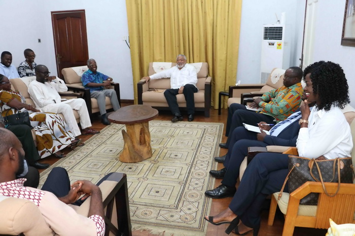 President Rawlings shares a hearty moment with the delegation