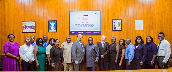 Some management members and staff of Ghana Post in a group photo with the two foreign postal consultants