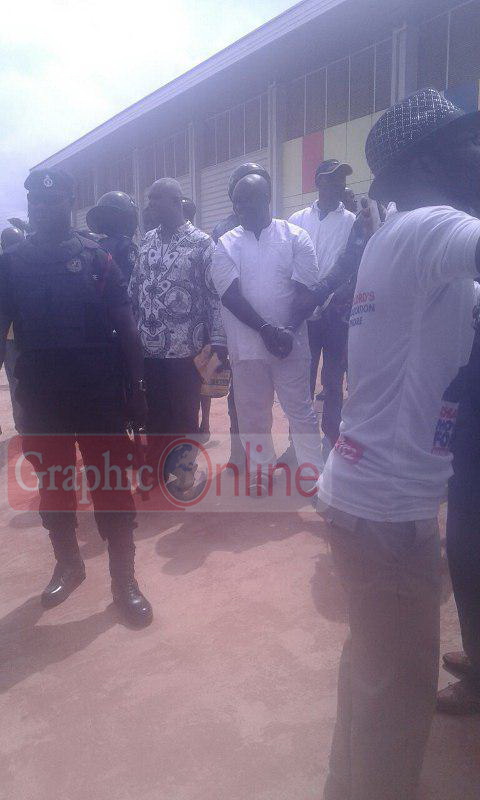Maxwell Kofi Jumah in handcuffs
