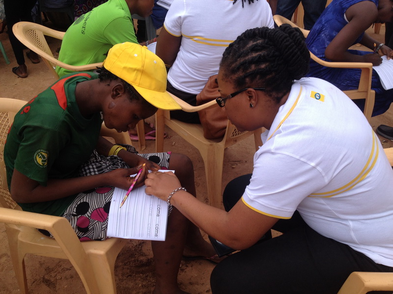 A Kayayei learning to write