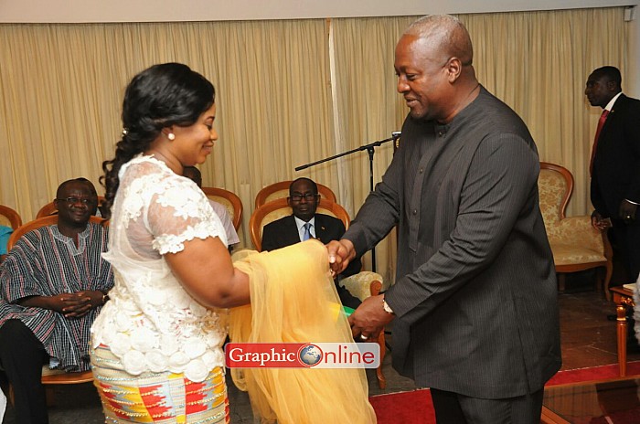 Receiving the scroll of office as new EC Chairperson from President John Mahama. Picture by Ebo Hanson