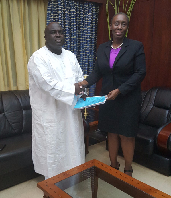 Chief of Staff Julius Debrah  left  receives report from the AG Marrietta Appiah Oppong