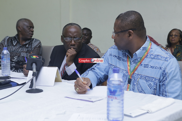 Dr Buckle and Prof Anthony Sallar share notes at the  press conference