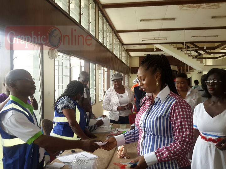 Incumbent MP Adowa Sarfo taking the ballot paper to cast her vote at the Dome Kawbenya Constituency