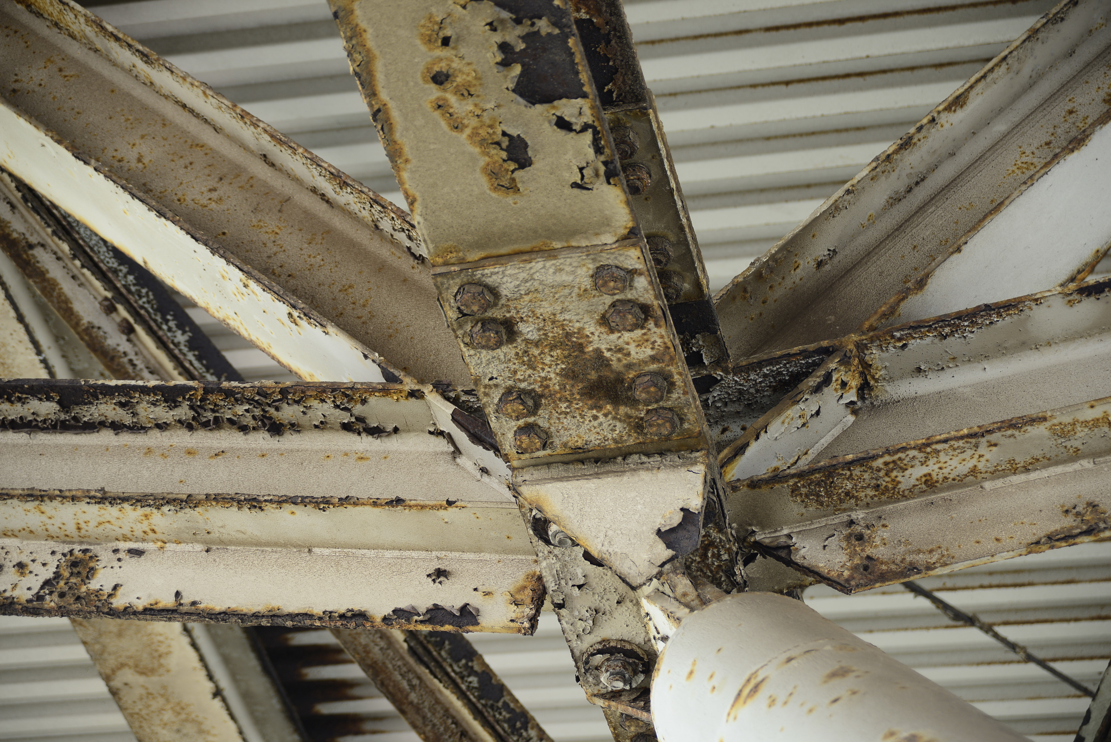 The rusted metals supporting the roof of the stadium