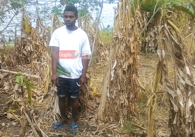 RIGHT: Daniel Aidoo pointing to where the Esi was buried. 