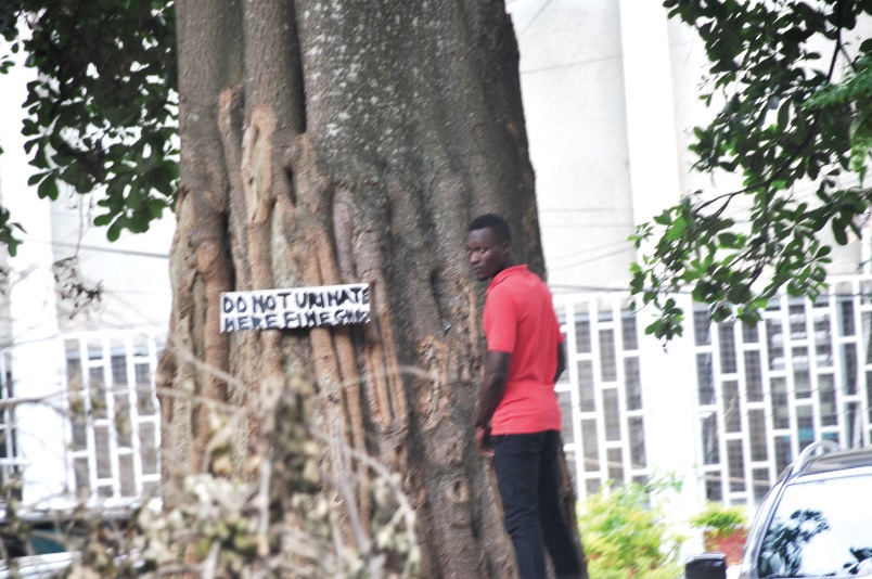 ministries2 This is one of the hundreds of people who urinate behind offices in the Kumasi Ministries