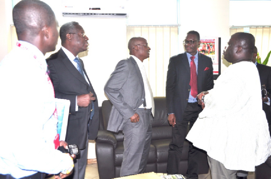 Mr. Kenneth Ashigbey (right), speaking to Mr. Afotey Odarteifio (2nd right), Mr. Doni Kwame, MD of World Trade Centre Accra and Mr. Willing Vanderpuye.