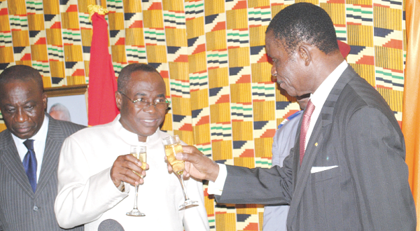 Mr Joe Oteng-Adjei (left), sharing a toast with Mr Bernard Ehui-Koutoua