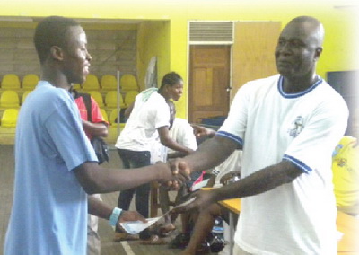 Daniel Sam receiving an award