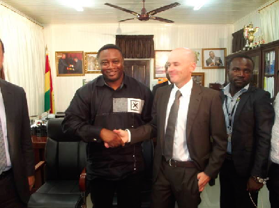 Youth and Sports Minister Elvis Afriyie-Ankrah (left) in a hearty handshake with Javier Cabello, General Director of ZEMAC, an affiliate of Spanish club, Valencia