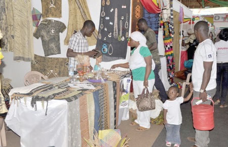 A visitor at the fair making an enquiry at the GRATIS Foundation stand. 
