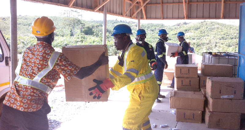 Staff of Zoomlion, contracted by FDA to incinerate the seized drugs at Nyankrom in the Shama District of the Western Region unpacking the drugs