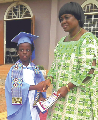 Ms Gloria Adzamli, a board member, presents a certificate to Nana Yaa.