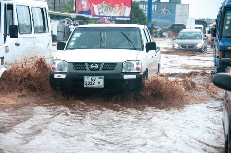 Vehicles driving through the flood water