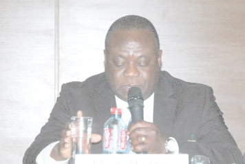 Mr Ekow Afedzie (left), Deputy MD of the GSE speaking at the symposium