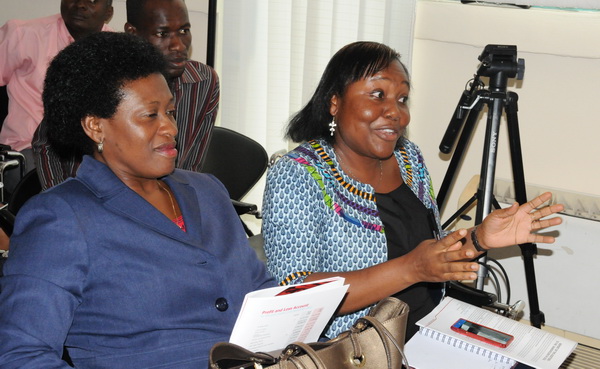 Mrs Irene Addo-Dankwah (right), an official of the Ministry of Finance making a remark. With her is Mrs Magdalene Apenteng, Director of Public Investment Department of the Ministry of Finance.