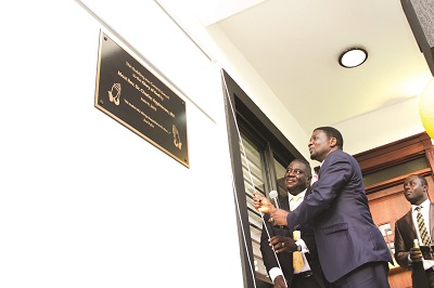 The Ceo of Innova DDB, Mr Joel Nettey (left), assisting Rev Dr Agyin Asare to inaugrate the new Innova head office in Accra.