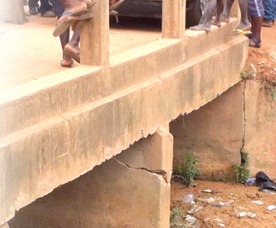 Part of the collapsed bridge. INSET: A close-up of a part that has caved in.