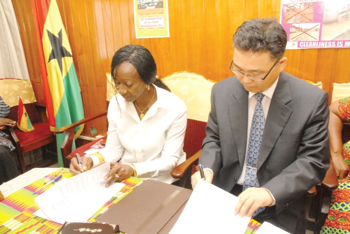 Ms Sherry Ayittey, Minister of Health and Mr Cho Kwangol, Country Director of KOICA in Ghana, jointly signing the $6 million grant for the maternal and child health project