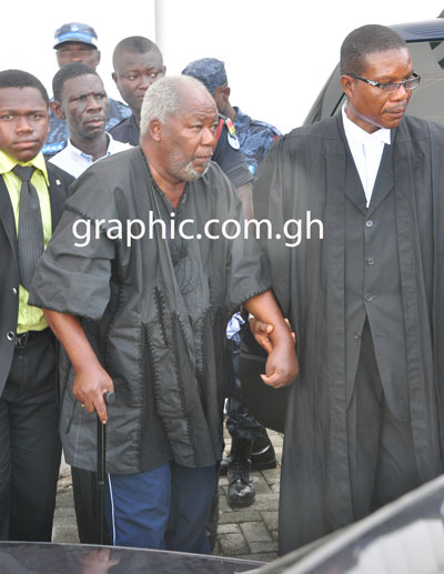 Frail looking Justice Kpegah being helped into his car after a court hearing on May 2, 2013