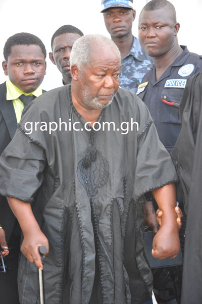 Frail looking Justice Kpegah being helped into his car after a court hearing on May 2, 2013
