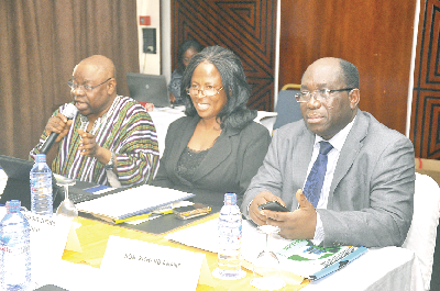 Mr. Yieleh Chireh, MP for Wa West stressing a point at the meeting. With him are Mrs Comfort Doyoe Cudjoe Ghansah, Minster of Social and Allied Agencies and Mr. Richard Anane (right) MP for Nhyiaeso