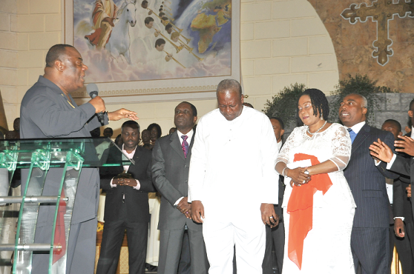 • Archbishop Duncan-Williams praying for President Mahama and wife, Lordina during their visit to the Action Chapel International on the Spintex Road in Accra.  Picture: EBOW HANSON 