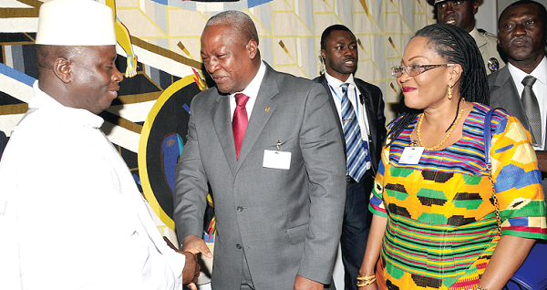 President Yahaya Jammeh of The Gambia congratulating President Mahama after the latter’s address. Looking on is the First Lady, Mrs Lordina Mahama. Picture: EBOW HANSON.