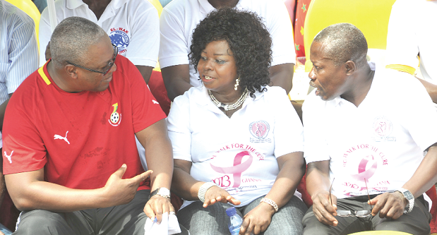 President Mahama interacting with Dr Beatrice Wiafe-Addai, President of Breast Care International and Dr Kwabena Opoku Asiedu, President of Ghana Medical Association (GMA) after the breast cancer awareness walk at Accra Sports Stadium. Picture: EBOW HANSON