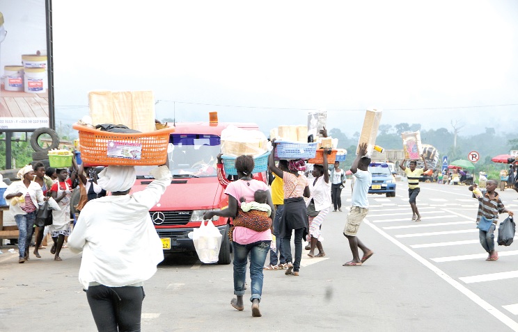 Hawking at Nkawkaw selling their food items