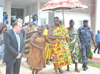 Otumfuo Osei Tutu (in  kente cloth) and his entourage, being seen off by Mr Bou-Dip (second left) and other officials of the company after he had inaugurated the office complex. Picture:  George Ernest Asare