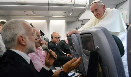 Pope Francis filing journalists questions while airborne.