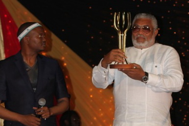 President Rawlings after receiving his trophy