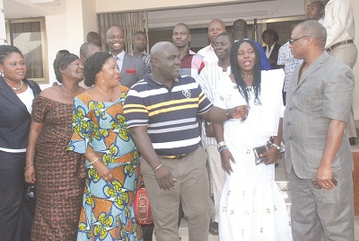  Ms Rita Odoley Sowah ( 2nd right), Municipal Chief Executive, La Dadekotopon Municipal Assembly, interacting with Nii Armah Tackie (right), MCE of Amasaman, while Mr Julius Debrah, Greater Accra Regional Minister (middle), and others listen. Picture: EMMANUEL BAAH