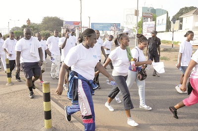  Unibank staff members walk on the Ako Adjei Interchange. Picture: EMMANUEL QUAYE