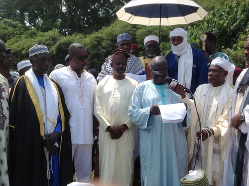 Western Regional Minister, Mr E.K.T. Addo reading his address while the Muslim leaders, his deputy and Regional Police Commander, Kofi Boakye look on