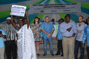 Nana Kwame Boakye of Sefwi Bekwai displaying his bonus cheque after it had been presented to him