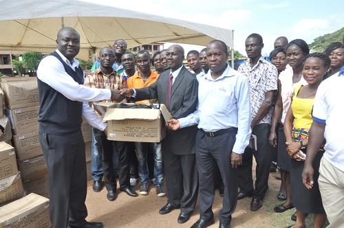 Mr Padmore Baffour Agyapong (left), Country Director, Compassion International, presenting the items to Rev. Anthony Kyeremeh CPC Chairman , Faith Community Baptist Church at the church premises.