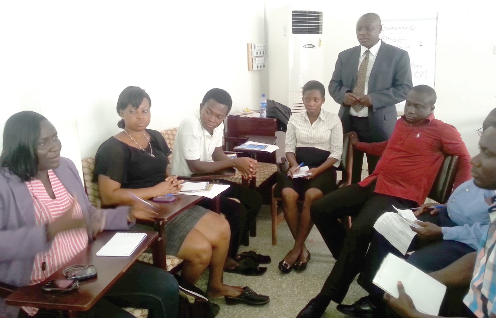 Edward Adu Aboagye, Manager of the Social Accountability Platform, interacting with some of the representatives of civil society groups at the workshop.