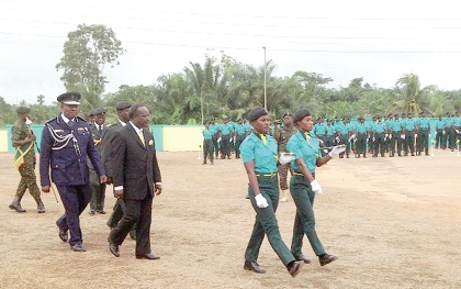 Mr Ahwoi after reviewing the parade. Behind him is COP Dr Peter Wiredu, Acting Director of GIS