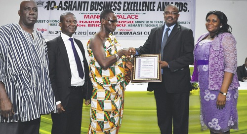Mr Sam Obiri Aduama (2nd Right) is joined by other top executives of the hotel to receive the award.