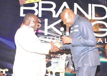 Mr Kenneth Ashigbey (left), MD of Graphic Communications Group Limited, exchanging pleasantries with Mr Obong Udobong Mbeye (right), after receiving the award.