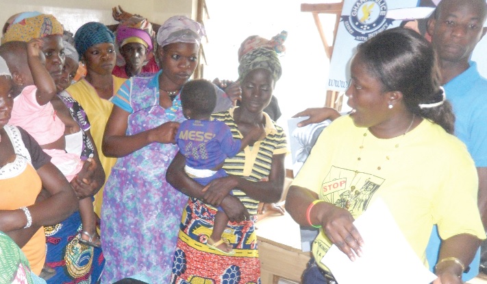 Ms Alfredtina A. Asiamah of the Anti-human Traffic Unit of the Ghana Police Service in Kumasi (right), addressing the head porters.